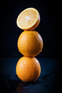 Stack of three juicy oranges