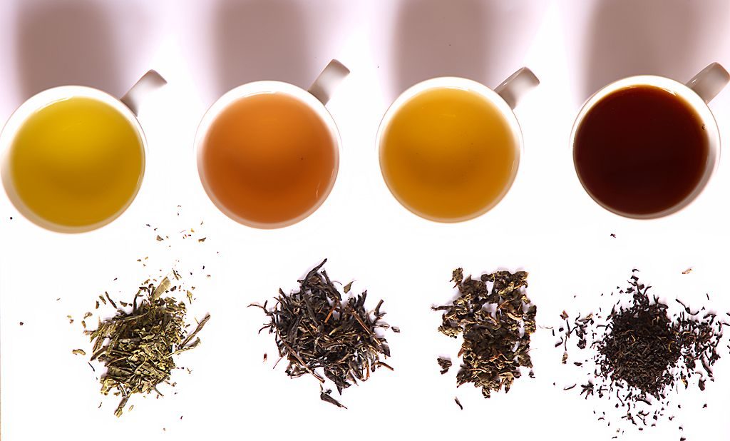 Different types of tea from left to right: green, yellow, oolong, black.