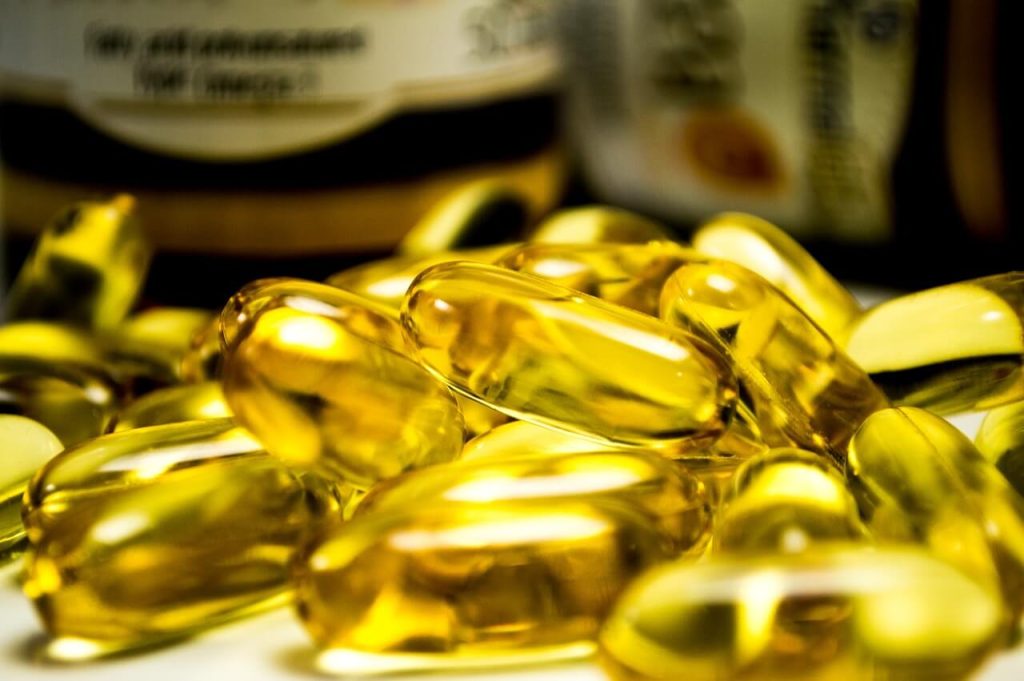 A heap of omega-3 fish oil pills representing Comparative Analysis of Joint Supplements