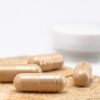 Capsules on a table representing natural joint supplements and their benefits