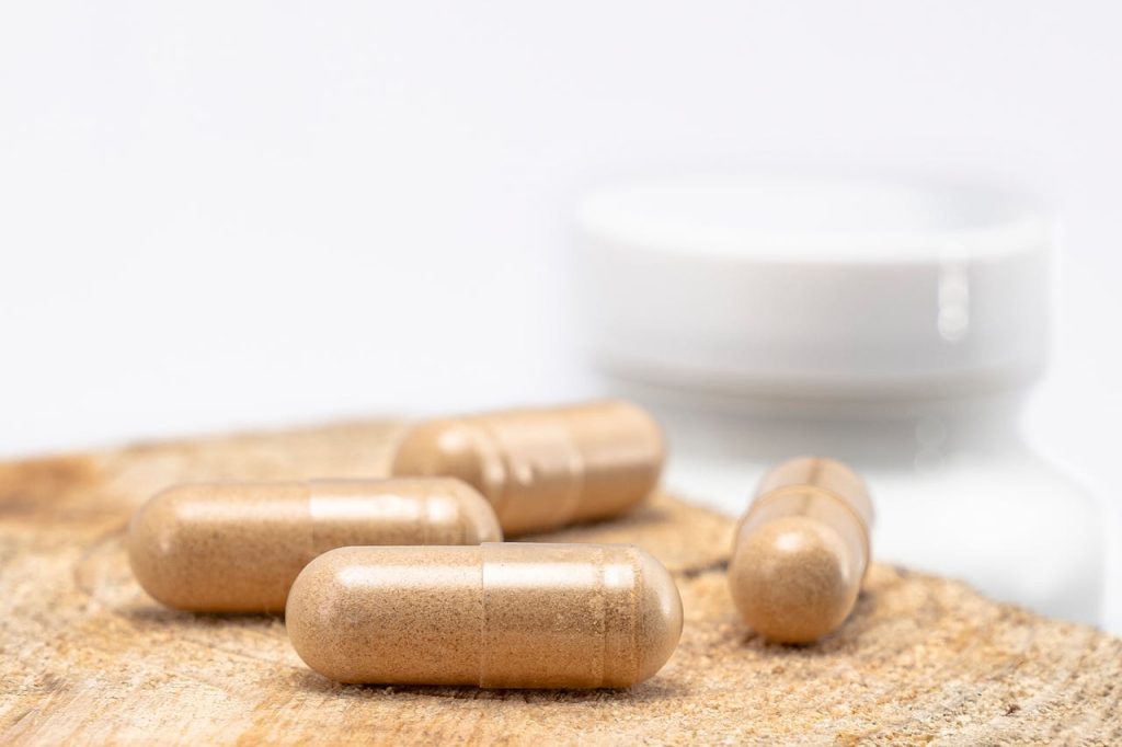 Capsules on a table representing natural joint supplements and their benefits