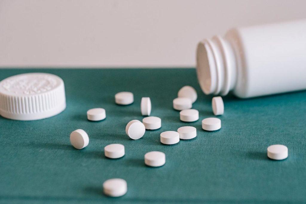 White pills representing the topic of boosting joint health improvement through supplements